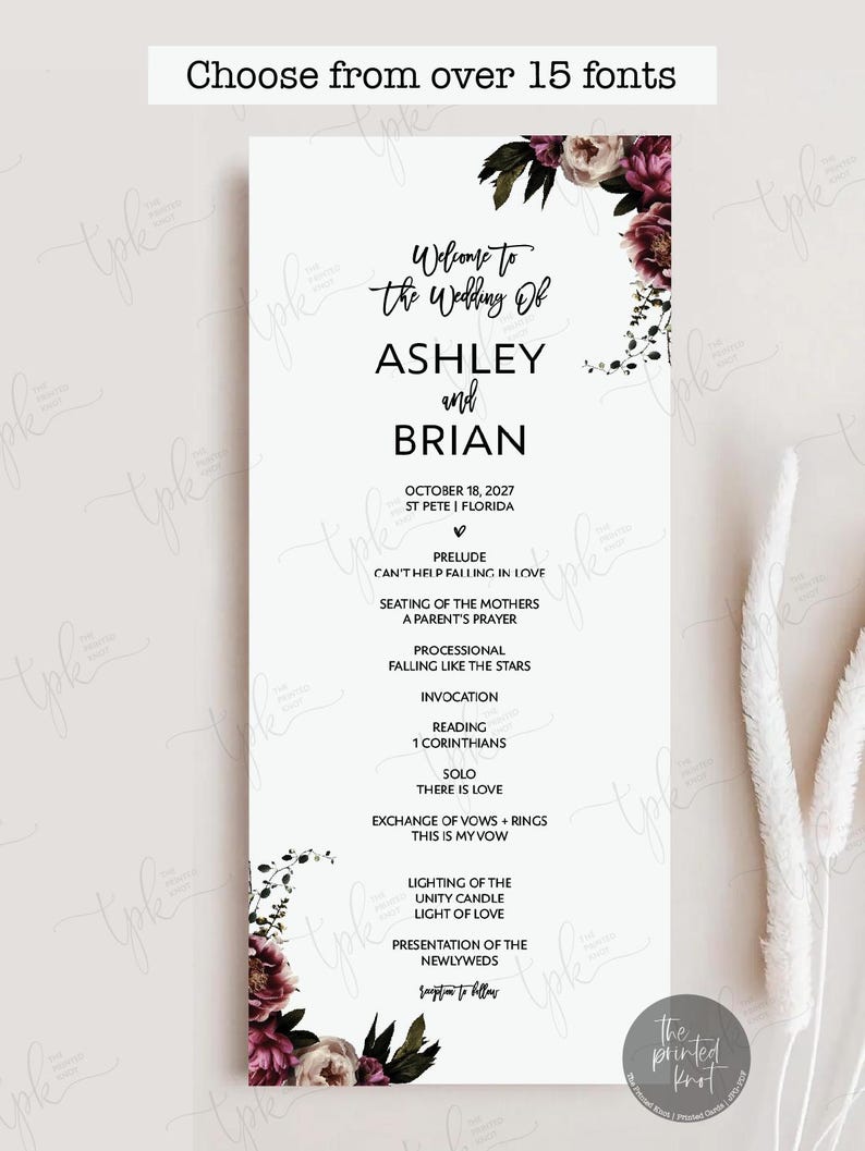May include: A vertical wedding program card featuring black text on a white background, adorned with dark purple and cream floral illustrations at the top and bottom corners. The text lists the wedding of Ashley and Brian on October 18, 2027.