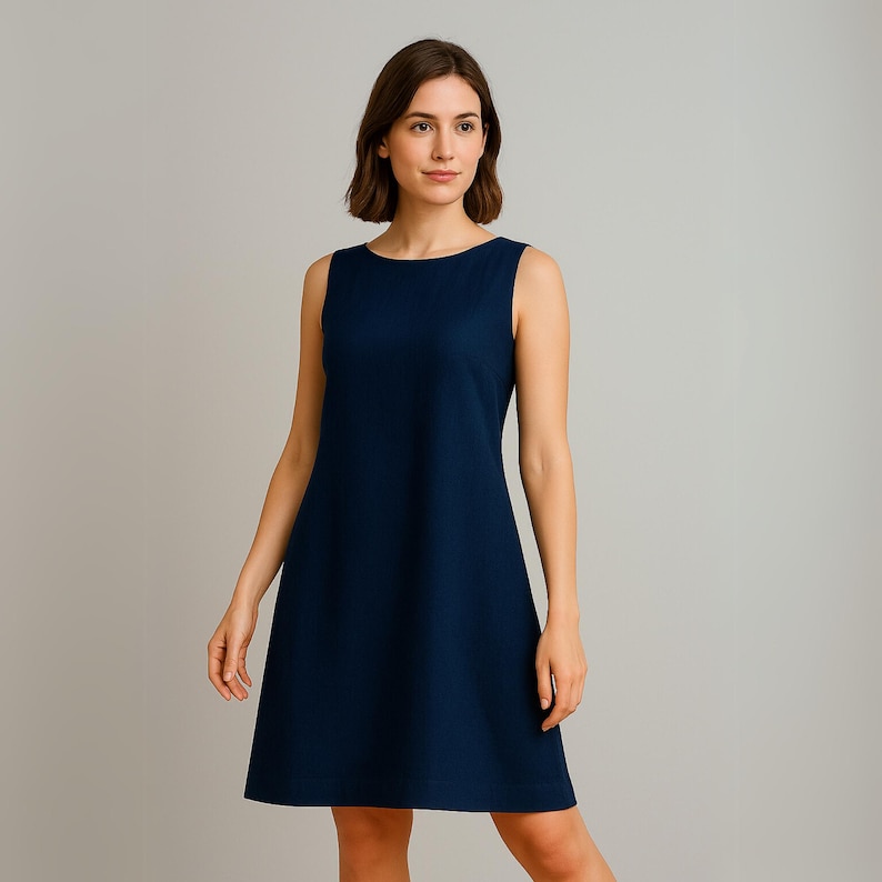 May include: A sleeveless navy blue dress with a scoop neck and a slightly flared skirt.