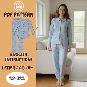 May include: A light blue floral pajama set, comprising a long-sleeved shirt and trousers. The image also displays a PDF pattern with English instructions and sizes XS-3XL. The model is wearing the pajama set.