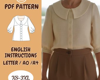 Blusa Peter Pan – Camisa oversize, cuello obispo, manga abotonada, corte holgado