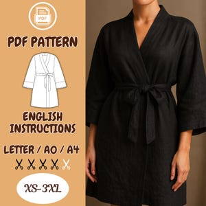 May include: Black robe with a tie waist, shown on a person. The image includes a diagram of the robe and text that reads "PDF PATTERN", "ENGLISH INSTRUCTIONS", "LETTER / AO / A4", and "XS-3XL".