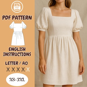May include: A cream-colored dress with a square neckline and short, puffed sleeves. The dress has a fitted bodice and a gathered skirt. The image also includes a PDF pattern graphic with the text "PDF PATTERN" and "ENGLISH INSTRUCTIONS". Sizes XS-3XL.