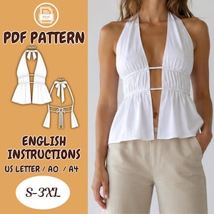 Può includere: Un top bianco allacciato al collo con profondo scollo a V, tessuto arricciato in vita e due cinturini orizzontali che collegano i pannelli frontali. L'immagine include il testo PDF PATTERN, ENGLISH INSTRUCTIONS, US LETTER / A0 / A4 e S-3XL.