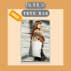 May include: A plain, off-white canvas tote bag with two shoulder straps. The bag is rectangular in shape and features a simple, unadorned design. The image includes text that reads BONUS and TOTE BAG, along with a yellow tag labelled FREE.