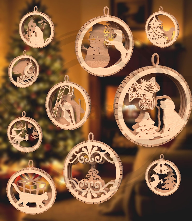 May include: A collection of wooden Christmas ornaments with various holiday-themed designs. Each ornament is circular with a cutout design, including a snowman, cat with a gift, and a nativity scene. The ornaments are made of light-colored wood and have a small loop for hanging.