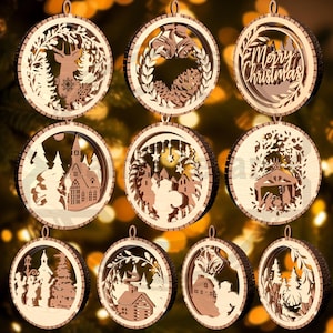 May include: A collection of wooden Christmas ornaments with various designs. Each ornament is circular with a light wood interior and a dark wood border. Designs include a deer, church, and the text "Merry Christmas".