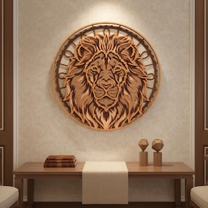 May include: A wooden lion head wall art piece. The lion's face is intricately carved with detailed fur and a regal expression. The artwork is circular, with a decorative outer ring, and is mounted on a beige wall. The piece is displayed above a wooden table.