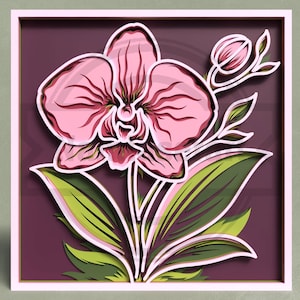 May include: A framed paper artwork depicting a pink orchid with green leaves and a bud. The design is layered, creating a 3D effect. The background is a deep purple, and the frame is light pink. The orchid's petals have detailed shading.