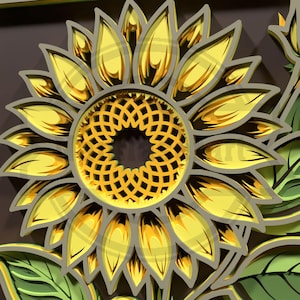 Puede incluir: Un dise&ntilde;o de girasol tridimensional en capas, con p&eacute;talos amarillos y un centro detallado. Los p&eacute;talos tienen un degradado dorado, y el dise&ntilde;o se establece sobre un fondo marr&oacute;n. Se ven hojas verdes en la parte inferior. El girasol es un elemento decorativo.
