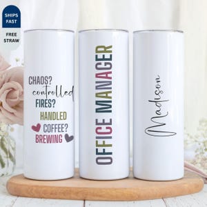 May include: Three white insulated tumblers. One tumbler has the text "CHAOS? controlled FIRES? HANDLED COFFEE? BREWING" in black, pink, and purple. Another has "OFFICE MANAGER" in green and pink. The third has the name "Madison" in black.
