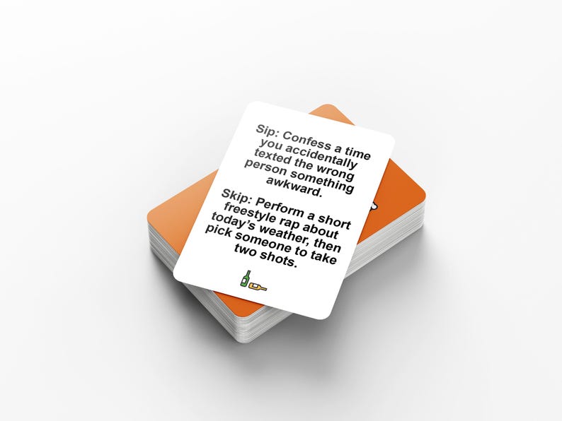 May include: A stack of orange-edged cards with a white card on top. The top card has black text that reads "Sip: Confess a time you accidentally texted the wrong person something awkward. Skip: Perform a short freestyle rap..."
