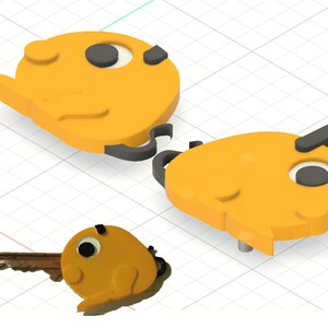 Peut inclure: Trois porte-clés orange en forme de poisson et une clé avec une tête en forme de poisson. Les porte-clés ont des accents noirs pour les yeux et les nageoires. La clé a un design similaire, avec une lame de clé attachée à la tête de poisson.