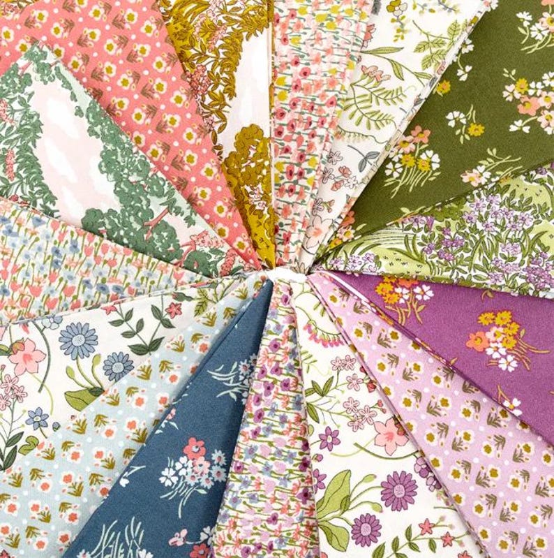 May include: A collection of floral patterned fabric swatches in a circular arrangement. The fabrics feature various colors, including pink, green, blue, and purple, with floral and botanical designs. The fabrics are likely cotton or a similar material, suitable for quilting or crafting.