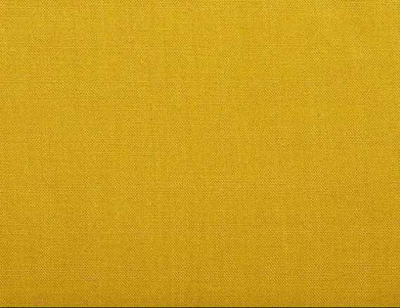 mustard yellow crib sheet