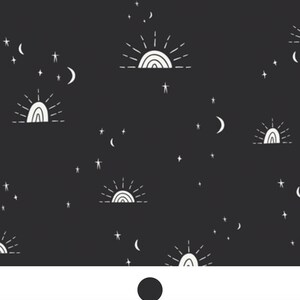 May include: A black fabric featuring a repeating white line art pattern of suns rising over a horizon, crescent moons, and various sizes of stars scattered across the surface. The design is consistent and evenly spaced throughout the material.