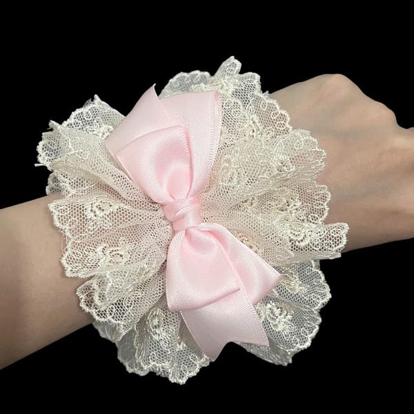Cream lace wrist cuff with light pink satin bow, handmade elastic bracelet accessory