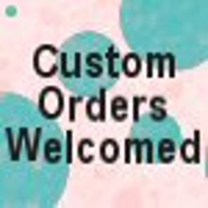 May include: Text that reads "Custom Orders Welcomed" in black text on a pink and teal background with large teal circles.