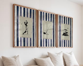 May include: Three framed golf-themed prints. Each print features a different golf image: a golfer swinging, a golf club, and a golf cart. The prints are set against a blue and white striped background and framed in wood.