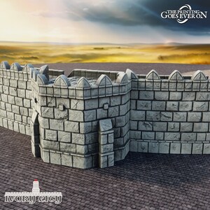 May include: A light grey, stone-effect castle wall section with battlements. The wall has darker shading, and the text "THE PRINTING GOES EVER ON" is visible. The Ivory City logo is at the bottom. The scene is set against a sunset.