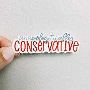 May include: A sticker with the words "unapologetically CONSERVATIVE" in red and light blue lettering. The sticker is held by a hand against a white background.