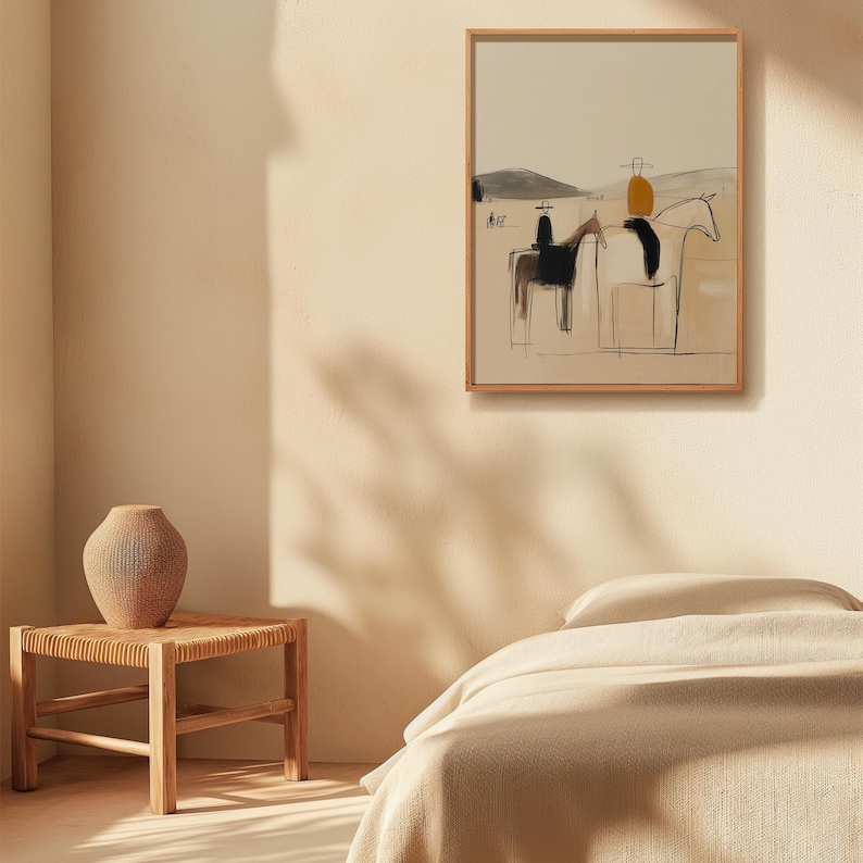 May include: Abstract art print in a wooden frame. The artwork depicts riders on horseback in a minimalist style, using black, beige, and yellow tones. The scene is set against a neutral background, creating a serene and artistic aesthetic.