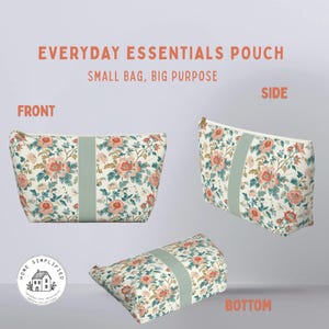 May include: A floral patterned pouch in peach, green, and cream, with a light green central stripe. The text reads "EVERYDAY ESSENTIALS POUCH" and "SMALL BAG, BIG PURPOSE". The bag is designed for everyday use.