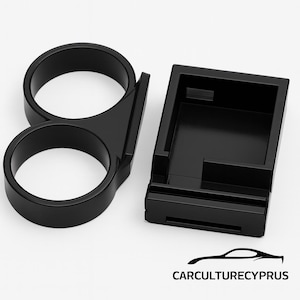 May include: Black plastic car accessory set. The set includes a dual-ring holder and a rectangular compartment. The brand name, CARCULTURECYPRUS, is printed in white at the bottom of the image.