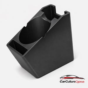 May include: A black plastic car console organiser with a cup holder and a small rectangular compartment. The organiser is angled and designed to fit in a vehicle. The CarCultureCyprus logo is in the bottom right corner.