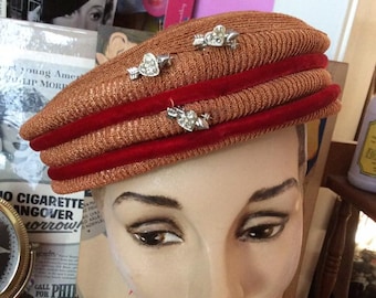 Vintage 1950s 1960s Hat Cellophane Straw Light Red With A Rusty-Brown Hue 3 Rhinestone Hearts W/Arrow Pin 2 Red Velvet Cords Adorn The Hat