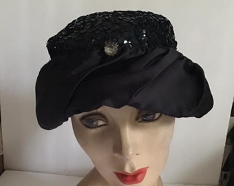 Vintage 1950's Hat Dark Black Satin And Sparkly Sequins With A Single Rhinestone Adorning The Front