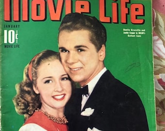 May include: A vintage magazine cover featuring a black and white photo of a man and woman in formal attire. The magazine is titled "Movie Life" and the cover text reads "Hollywood's Only All-Picture Magazine Presents Jackie Cooper's Movie Life!"