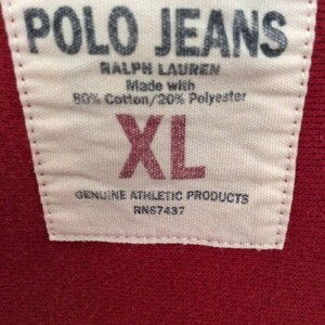 May include: White tag with black text that reads "POLO JEANS RALPH LAUREN Made with 80% Cotton/20% Polyester XL GENUINE ATHLETIC PRODUCTS RN87437"