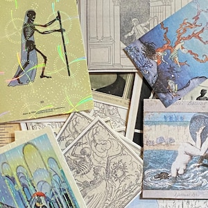 May include: A collection of vintage-style tarot cards featuring illustrations of skeletons, figures in flowing robes, and scenes of the sea. The cards have a variety of colors, including blue, yellow, and black, with some cards having a holographic sheen.