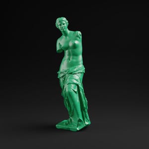 May include: A green statue of Venus de Milo, a classical sculpture, stands on a rectangular base. The statue is missing both arms and is draped in flowing fabric. The background is a solid black.