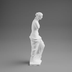 May include: A white sculpture of a classical female figure, standing in a draped pose. The statue has a smooth, matte finish and is set against a gray backdrop. The figure's arms are crossed, and the drapery adds texture.