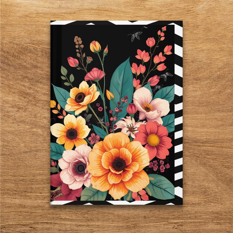 Notebook cover with vibrant floral illustration and black and white striped border.