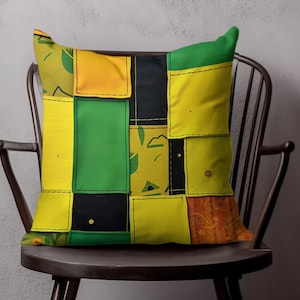 May include: Square decorative pillow with a patchwork design in yellow, green, black, and orange. The pillow is placed on a dark wooden chair, showcasing its vibrant colors and geometric pattern. The pillow's design features stitched squares.
