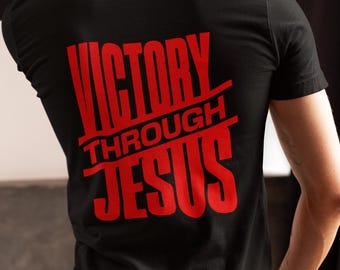 Camiseta unisex de algodón "Victoria por medio de Jesús": Camiseta cristiana inspiradora