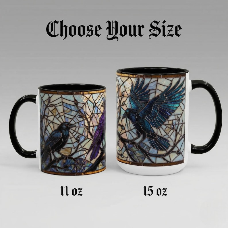 May include: Two ceramic mugs with black handles and rims. The mugs feature a stained-glass design with a raven perched on a branch. The text "Choose Your Size" is above the mugs. One mug is labeled "11 oz" and the other "15 oz".