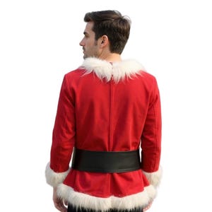 May include: A red Santa Claus jacket with white faux fur trim on the collar and cuffs. The jacket has a black belt around the waist. The person is facing away from the camera.