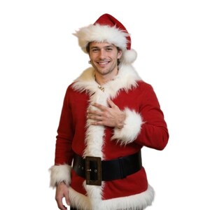 May include: A red Santa Claus suit with white faux fur trim. The outfit includes a jacket, hat, and a black belt with a gold buckle. The jacket has white fur trim around the collar, cuffs, and hem. The Santa hat is red with a white fur trim.