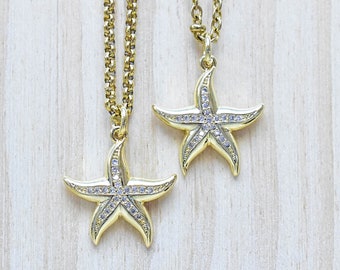 Collier doré à breloques étoile de mer : pendentif cristal strass