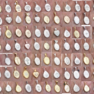 May include: A collection of 48 silver and gold oval locket pendants with various engraved designs. The lockets are on chains and feature designs such as trees, hearts, crosses, stars, and footprints.