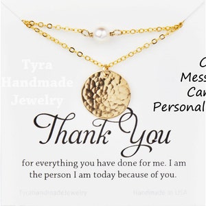 May include: Gold necklace with a hammered circle pendant and a single pearl charm. The necklace is displayed on a white card with the text "Thank You" and a message that can be personalized.