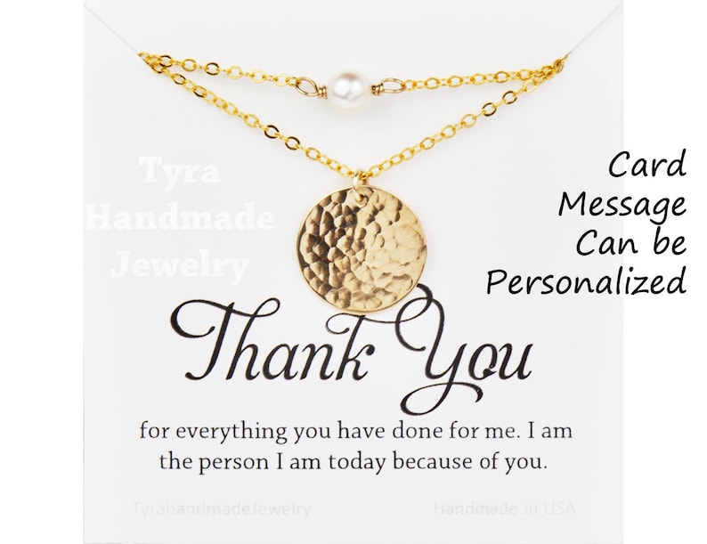 May include: Gold necklace with a hammered circle pendant and a single pearl charm. The necklace is displayed on a white card with the text "Thank You" and a message that can be personalized.