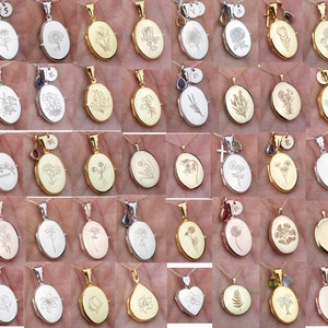 May include: A collection of silver, gold, and rose gold oval locket necklaces with engraved floral designs. Each locket features a different floral pattern, including a dandelion, a fern, and a tulip.