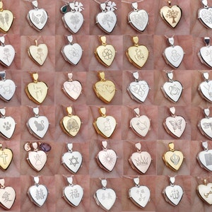May include: A collection of silver and gold heart-shaped locket necklaces with various engraved designs, including symbols, words, and images.