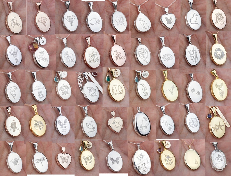May include: A collection of silver and gold oval locket pendants with various engraved designs, including animals, nature scenes, and abstract patterns. The lockets are displayed on a hand.