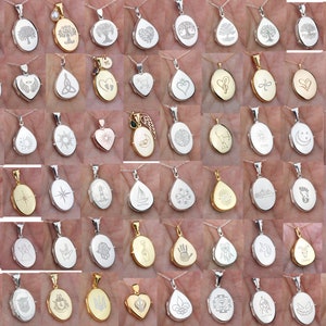 May include: A collection of silver and gold oval and teardrop shaped lockets with various engraved designs. The lockets are on chains and are displayed on a hand.