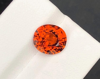 Vivid Orange Sapphire 5.75ct Oval Cut: AIGS Certified Loose Gemstone
